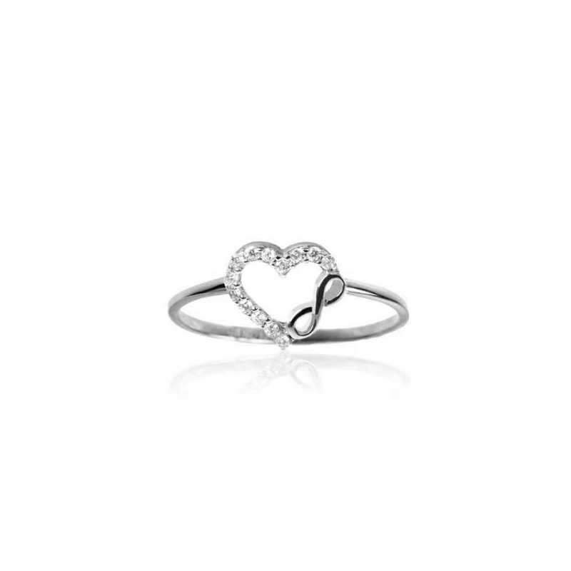 Anillo corazón de circonitas e infinito de oro blanco 18k.